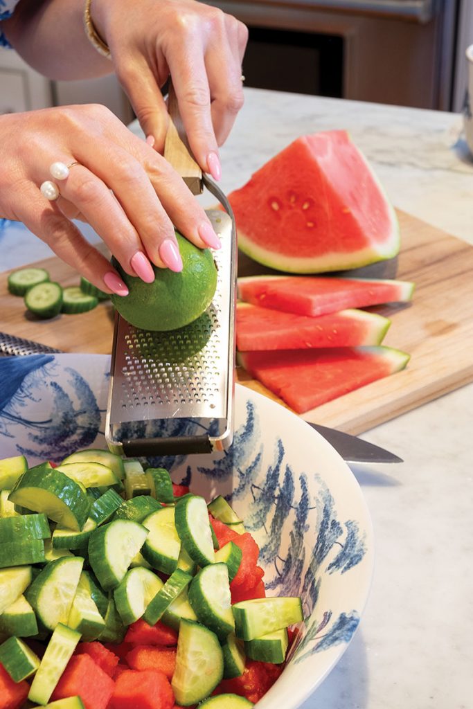 Ivey making the Cucumber Watermelon Salad. Photography Jerry Rabinowitz