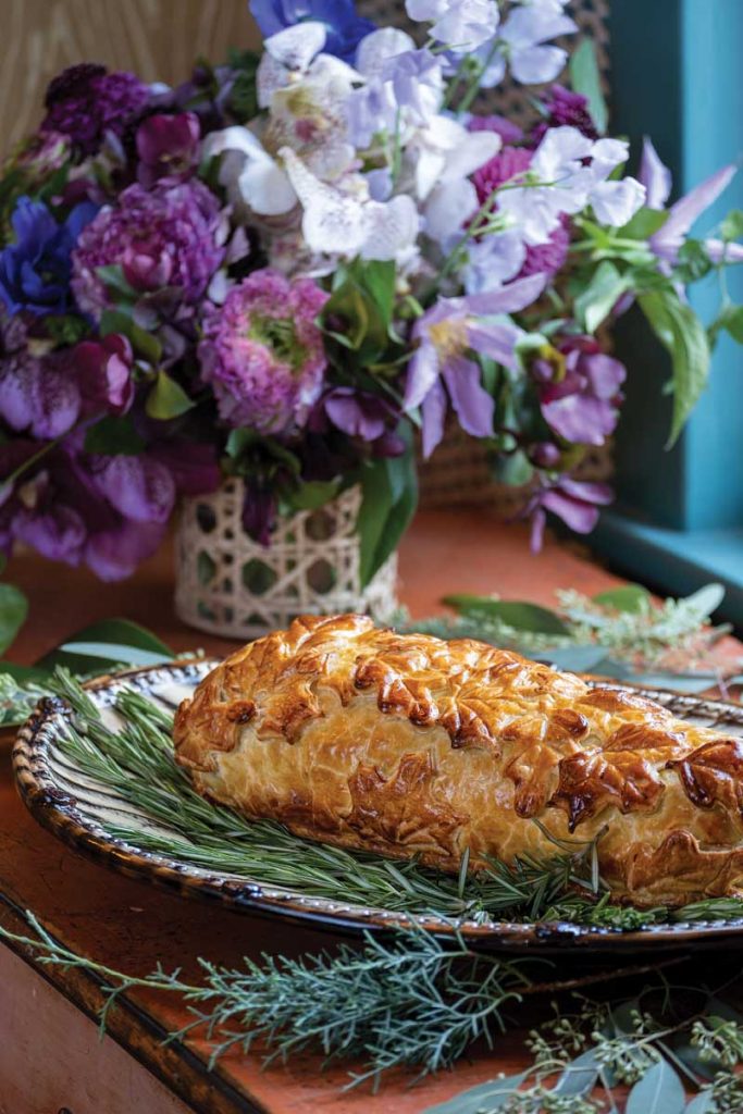 The main course included a Surf & Turf Wellington and sides such as herb-roasted romanesco with pomegranate seeds and toasted pine nuts. Photography by Jerry Rabinowitz