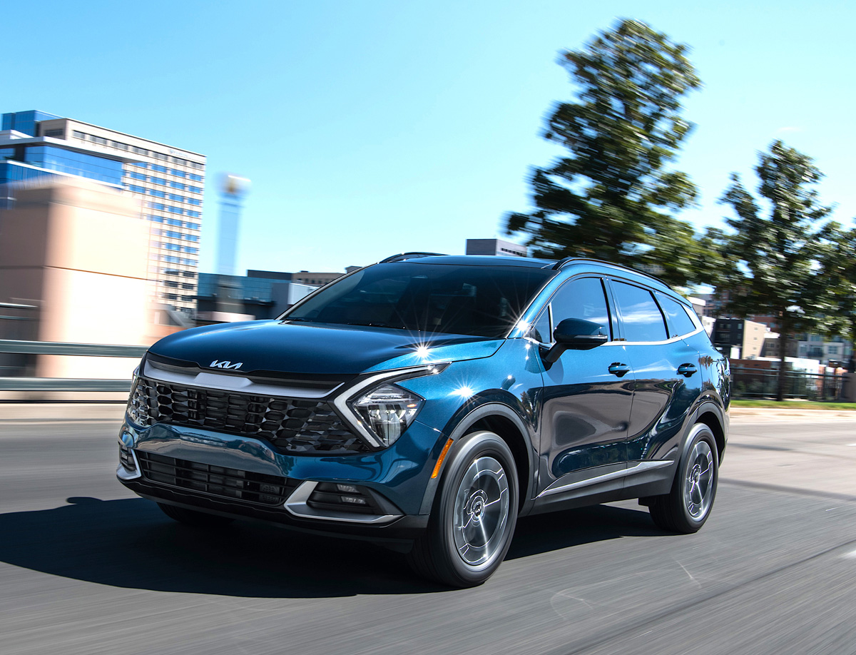https://cdn.palmbeachillustrated.com/wp-content/uploads/sites/78/2023/01/2023-Kia-Sportage-Hybrid-EX-AWD-with-Premium-package-driving.jpg
