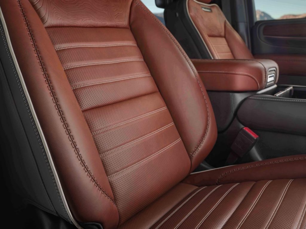 The Yukon Denali Ultimate features an Alpine Umber interior finished in full-grain leather with refined plaited contrast stitching. The 16-way power seats include massaging.