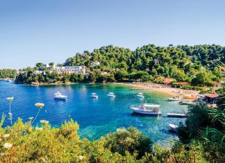 Troulos Beach in Skiathos is known for its crystal-clear, calm water. Photo courtesy of iStock