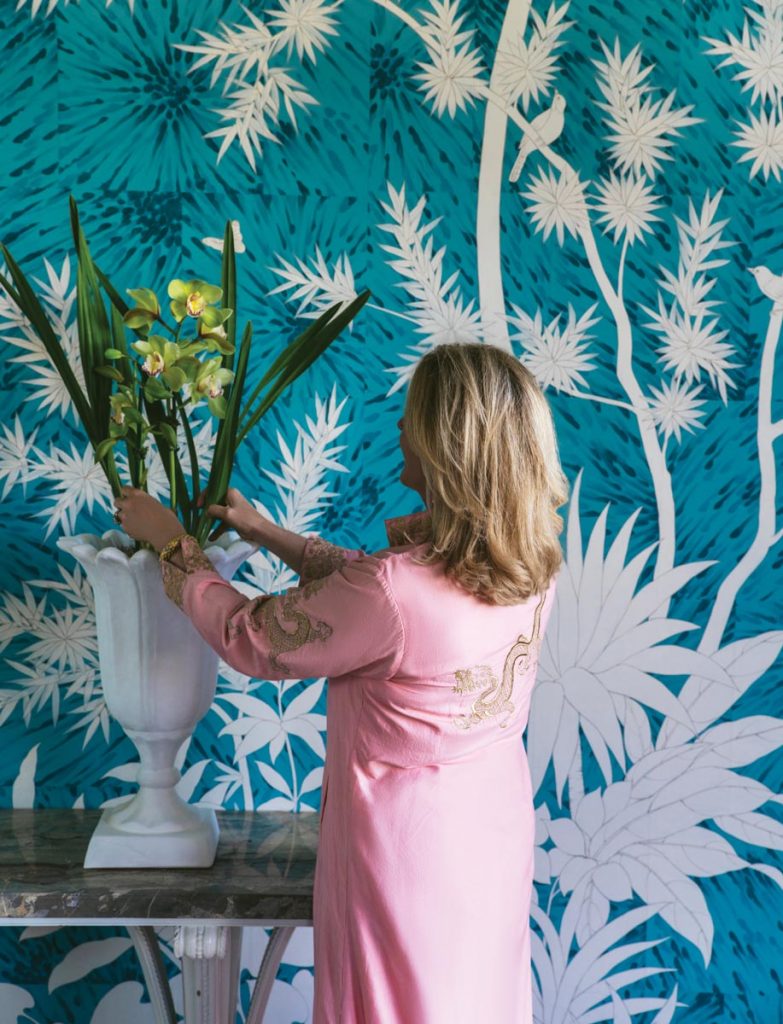 Braff arranging florals ahead of the gathering. Photo by Nick Mele