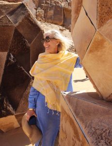 Schoeller admires rock art along the “Incense Road” in al-Ula, Saudi Arabia. Photo courtesy of Brewer Schoeller