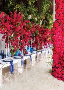 The couple invited guests to their North County home for a Greek-inspired gathering, complete with cascades of pink flowers and stunning details in blue and white. Photo by Jerry Rabinowitz